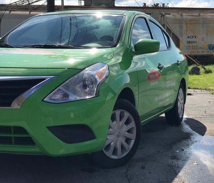 Servpro car outside of a commercial building