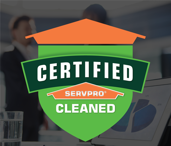 two people shaking hands with a Certified: SERVPRO Cleaned sticker over the photo