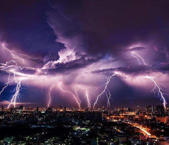 multiple lightning strikes across a city