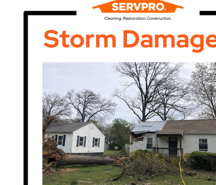 A picture of a home damaged due to a storm that has been tarped and is waiting for restoration services.